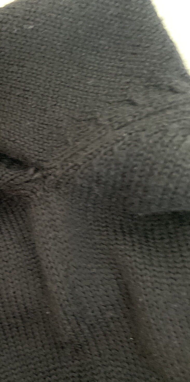 Detailbild lose Fäden Ärmelbereich